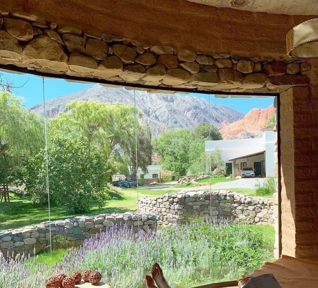 The spa's round stone window, open onto the lavender garden and the hills